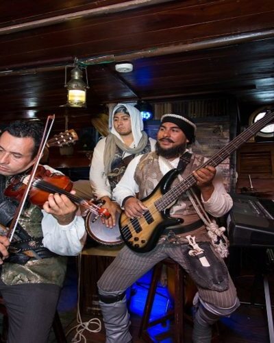 Live music performance on the Jolly Roger pirate ship, adding entertainment and atmosphere to the pirate-themed experience.