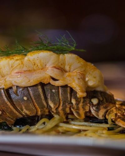 Close-up of a delicious dinner served onboard the Jolly Roger, enhancing the pirate-themed adventure in Cancun.