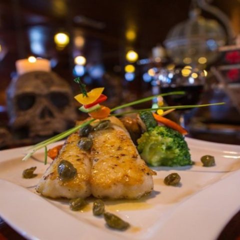 Fine dining experience on the Jolly Roger pirate ship, with carefully crafted dishes served during the show.