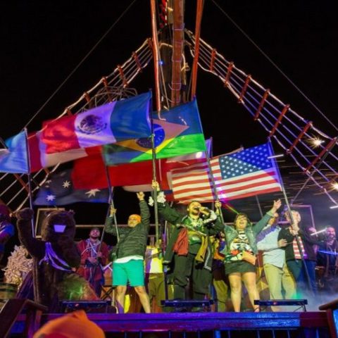 Pirate show performance on the Jolly Roger pirate ship, featuring actors in costume entertaining the crowd with lively action.